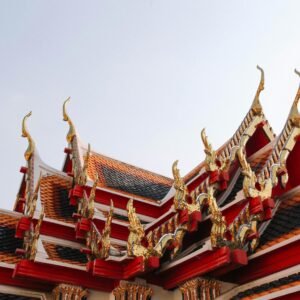Captivating view of traditional Thai temple roof with ornate details in Bangkok, Thailand.