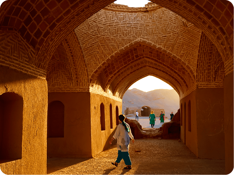 person-walking-through-archway-with-sign-that-says-word-it 1