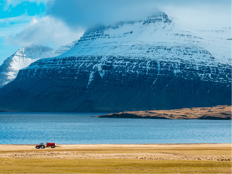 tractor-field-with-amazing-snowy-mountains 1